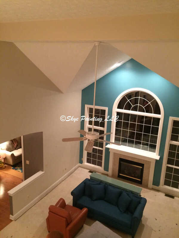 blue 2 story living room after painting. Skye Painting