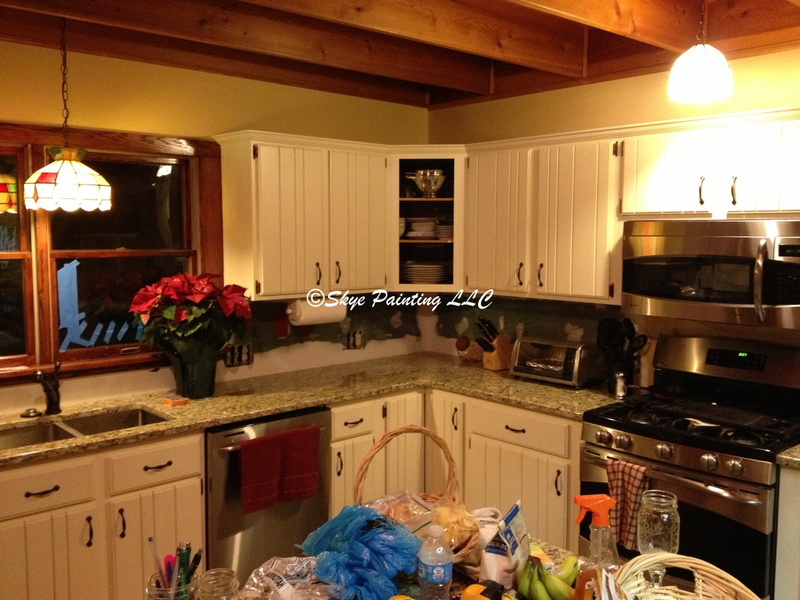 Cabin kitchen after painting cabinets. Skye Painting